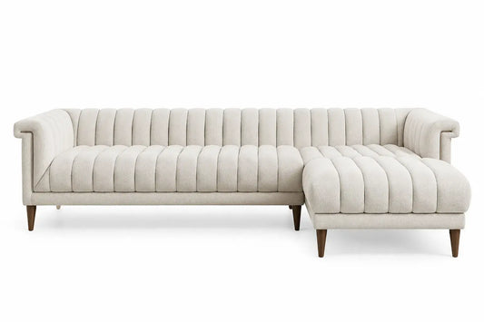 White L-shaped sofa with vertical seam backrest, modern design by WetandWestCoast, showing plush cushions and sleek upholstery.