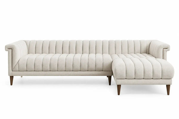 White L-shaped sofa with vertical seam backrest, modern design by WetandWestCoast, showing plush cushions and sleek upholstery.